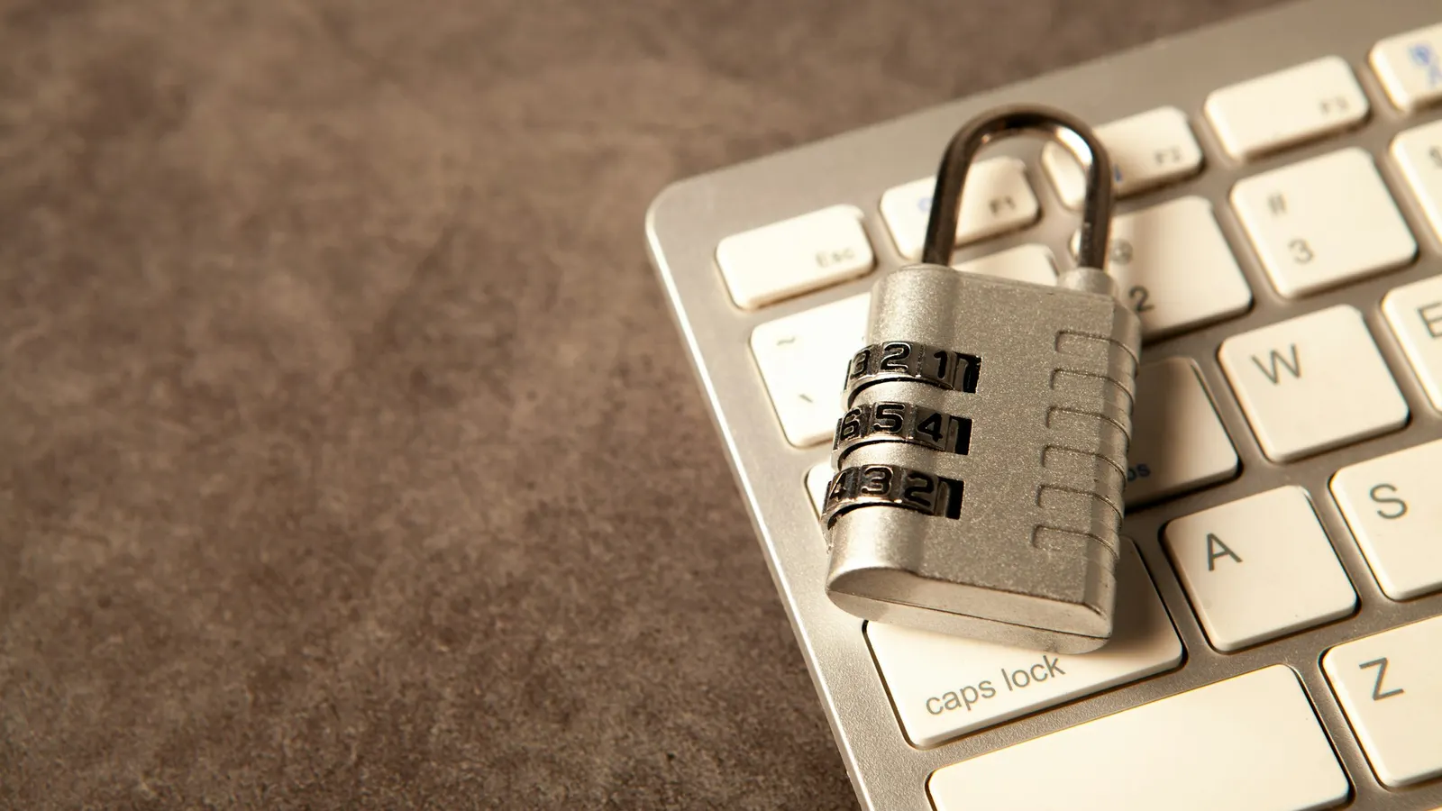Padlock resting on a laptop keyboard