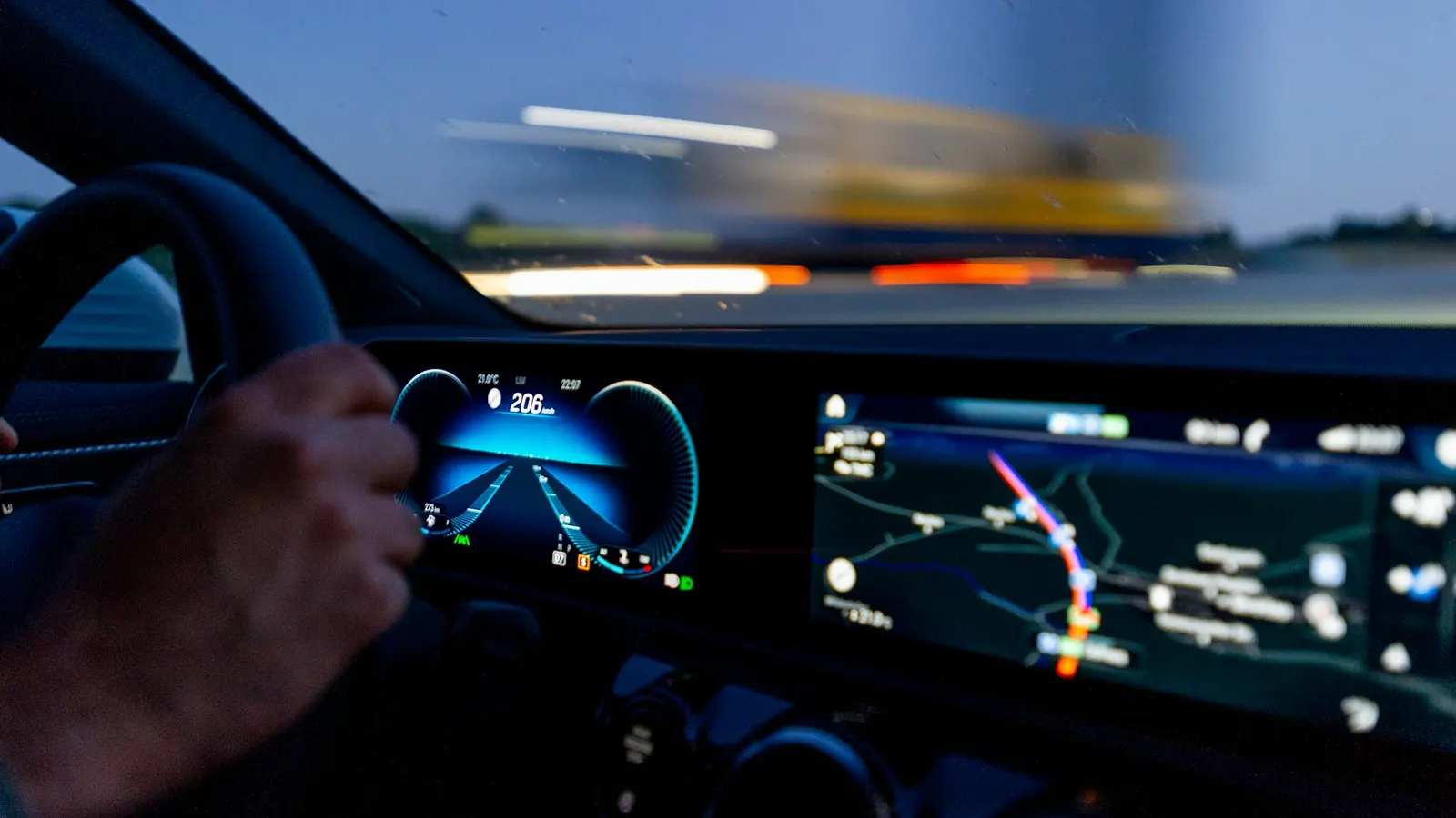 Hand on a steering wheel while driving