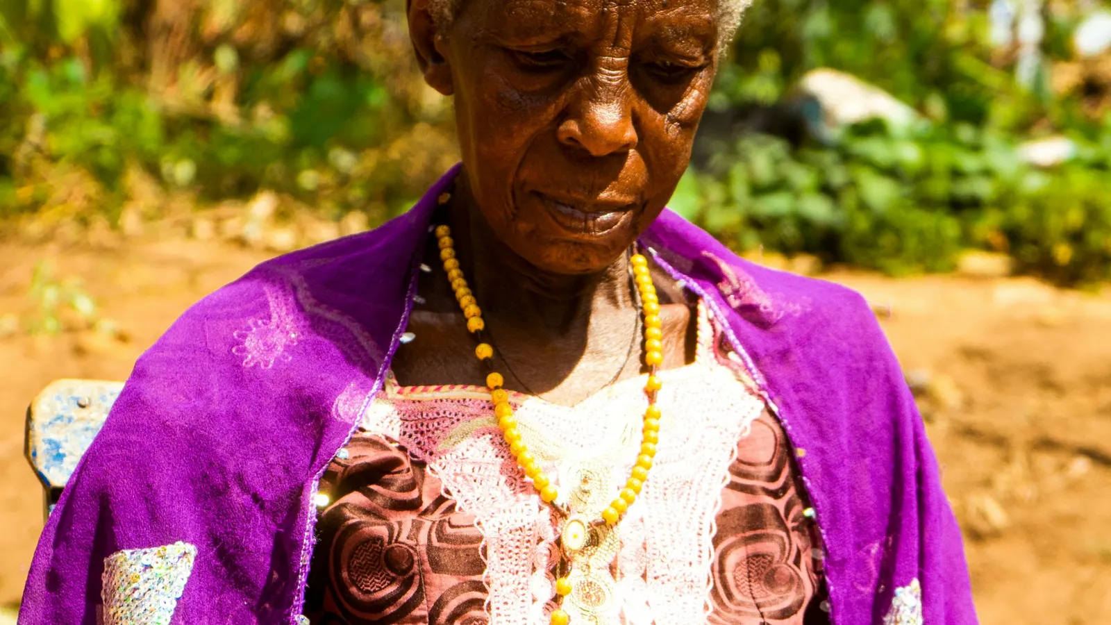 Older woman sitting and reading a book