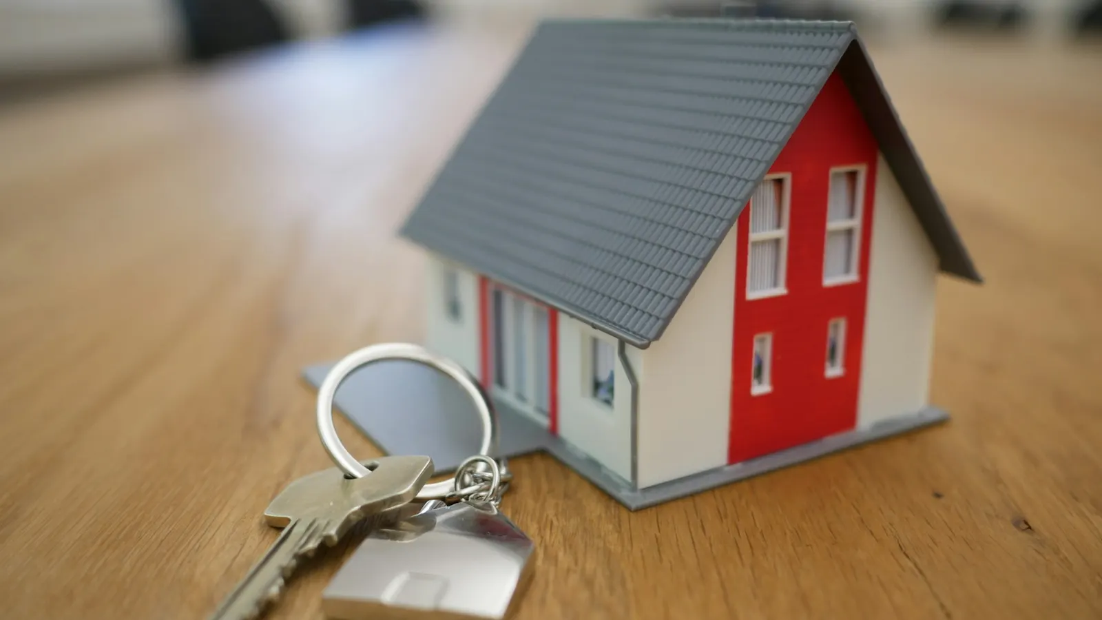 Miniature model house on a wooden table